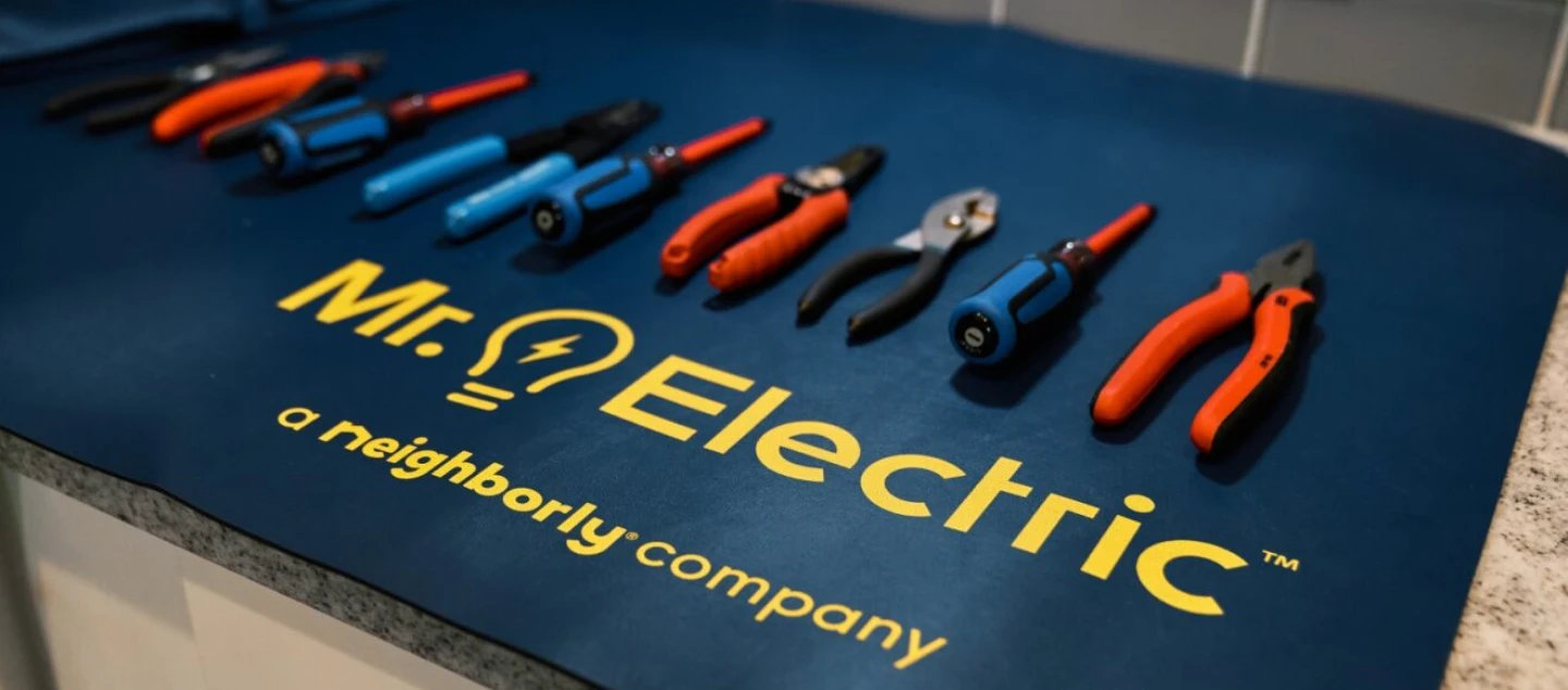Mr. Electric tool mat with tools on countertop.